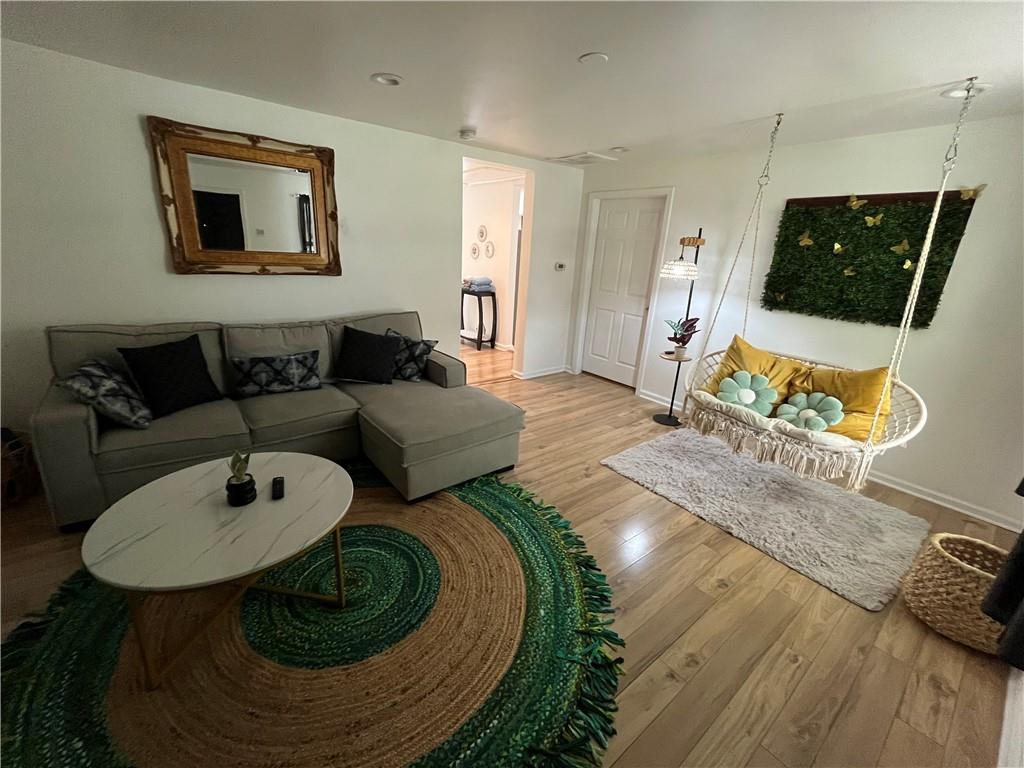 718 Fairburn Road Northwest Atlanta, GA 30331 - Photo 2 of 6 a living room with furniture and a wooden floor