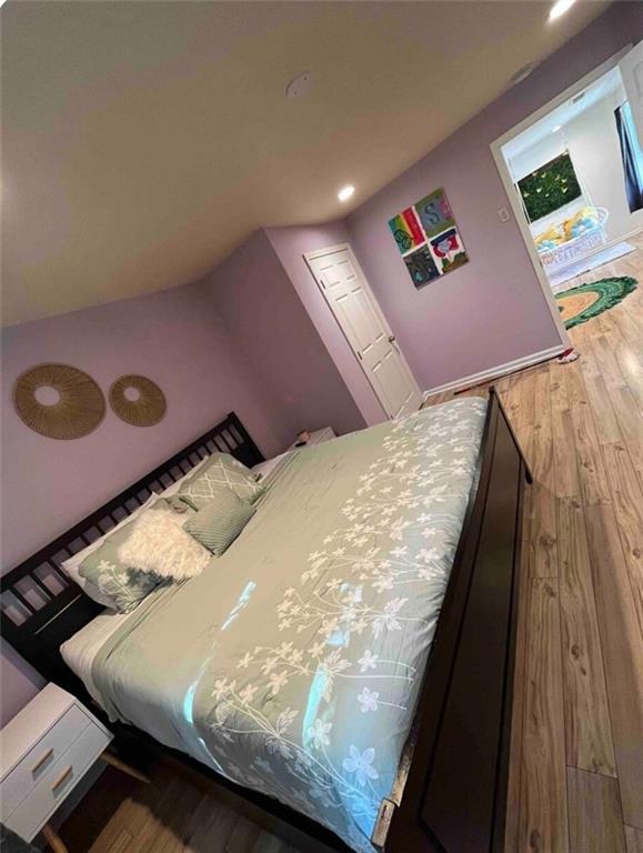 718 Fairburn Road Northwest Atlanta, GA 30331 - Photo 5 of 6 a bed sitting in a bedroom next to a lamp