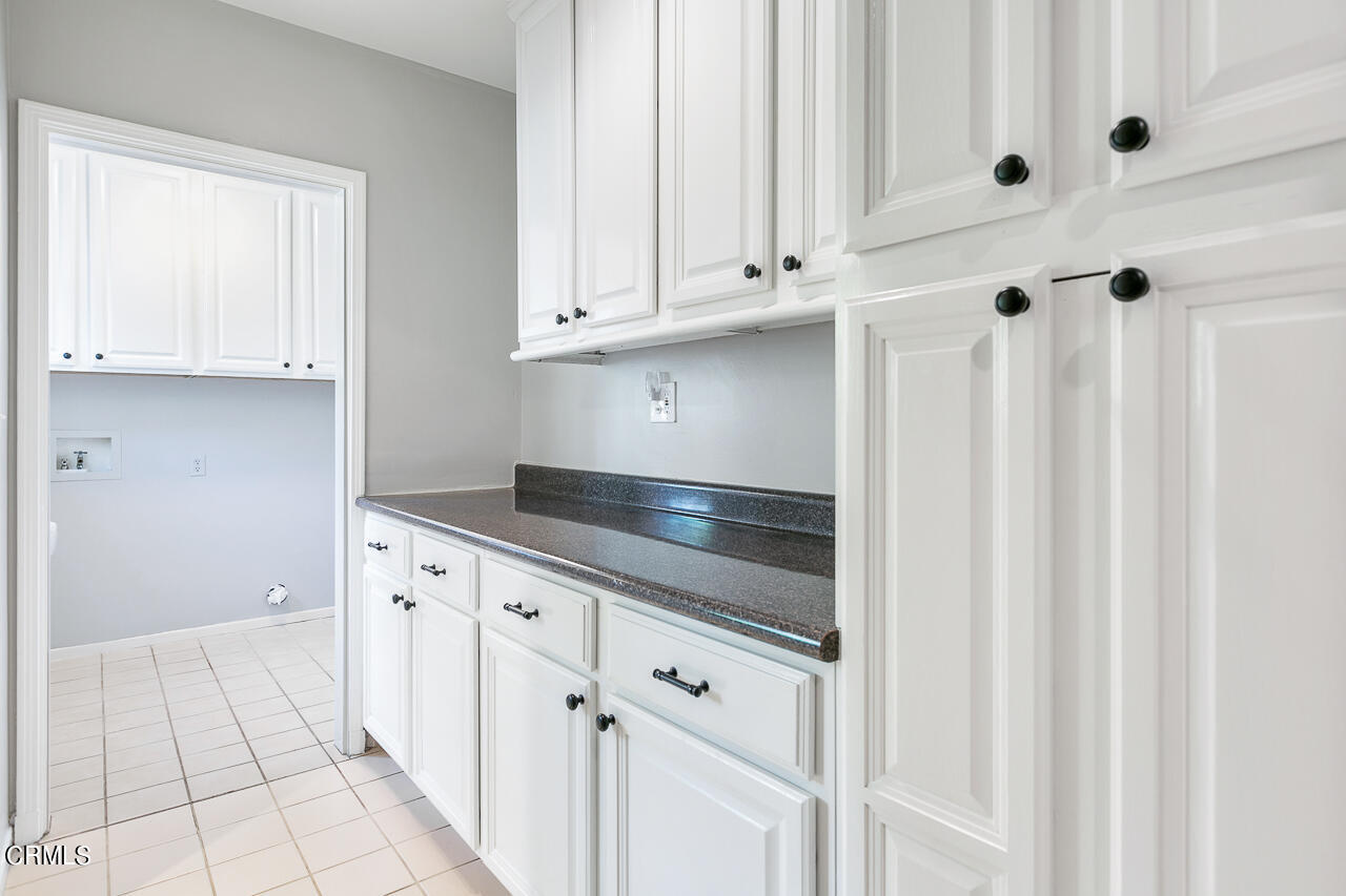 1195 Afton Street Pasadena, CA 91103 - Photo 14 of 36 a kitchen with white cabinets