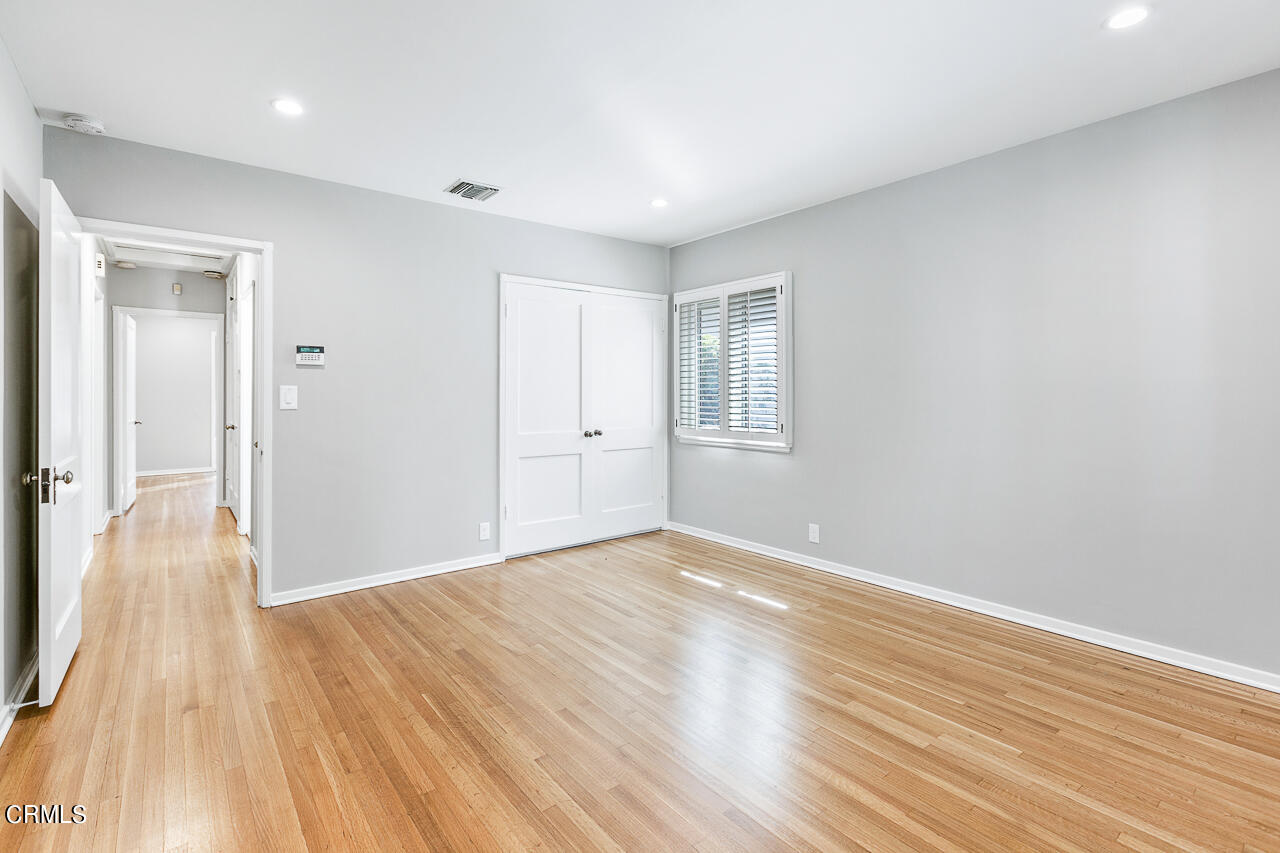 1195 Afton Street Pasadena, CA 91103 - Photo 17 of 36 wooden floor in an empty room with a window