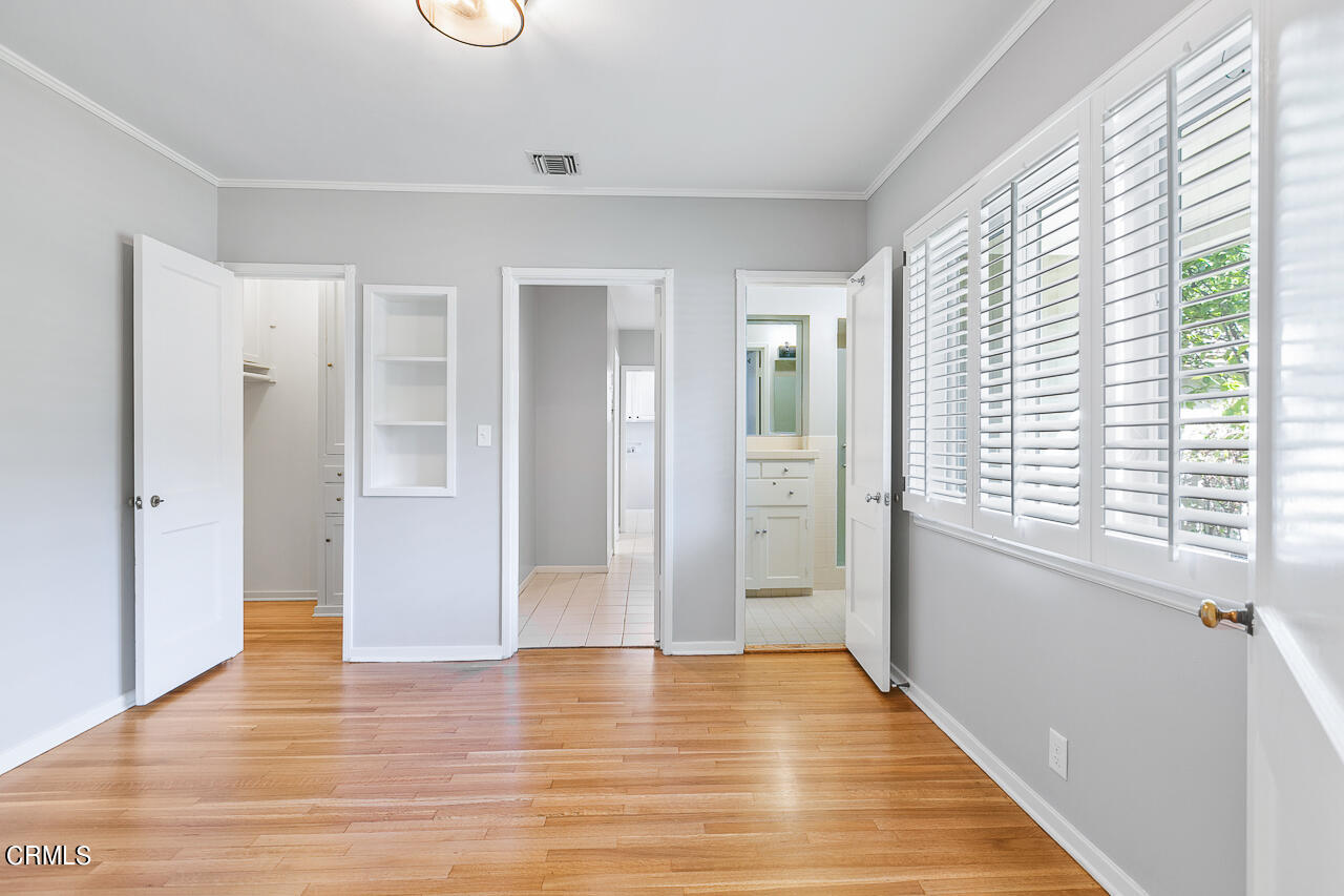 1195 Afton Street Pasadena, CA 91103 - Photo 21 of 36 a view of an empty room with wooden floor and a window