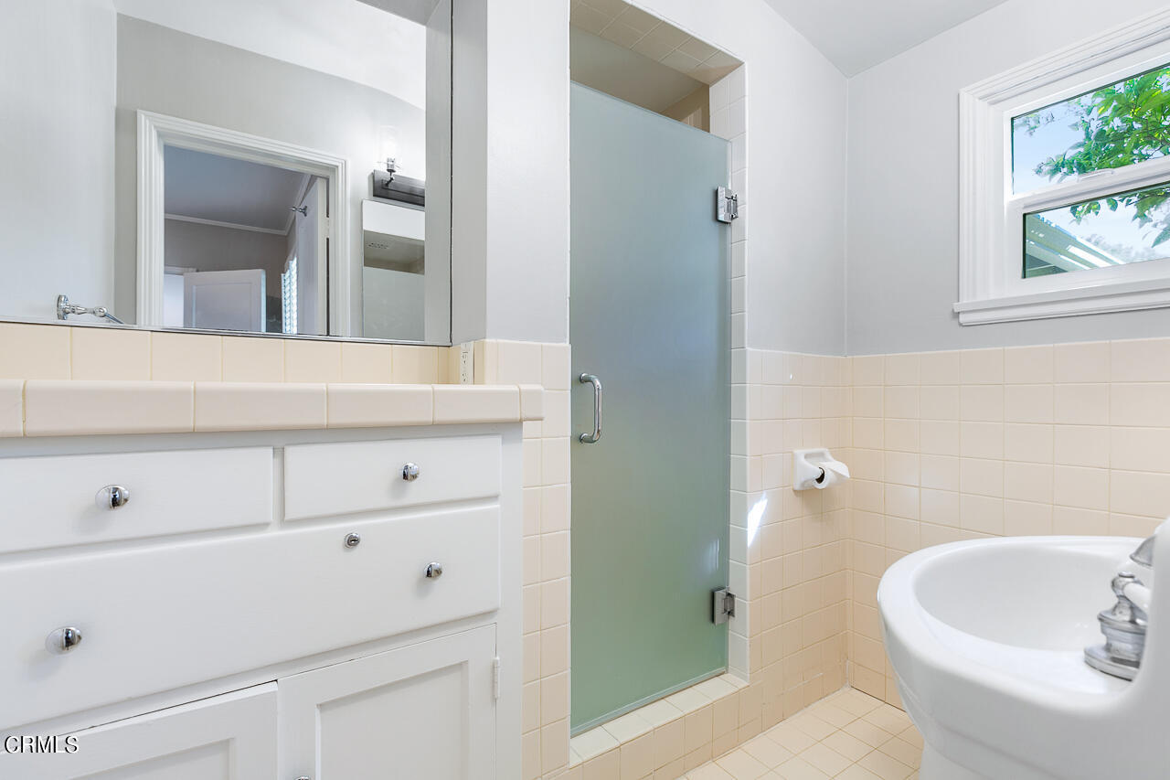 1195 Afton Street Pasadena, CA 91103 - Photo 22 of 36 a bathroom with a sink and a mirror
