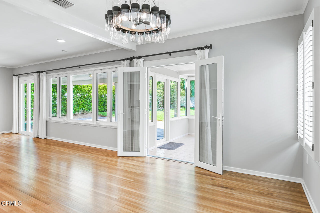 1195 Afton Street Pasadena, CA 91103 - Photo 9 of 36 a view of an empty room with wooden floor and a window