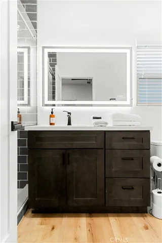a bathroom with a sink and a mirror