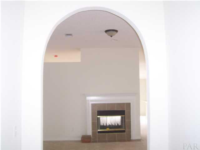 2278 Liberty Loop Road, Unit 24D Cantonment, FL 32533 - Photo 5 of 24 view from foyer looking into living room at double sided fireplace