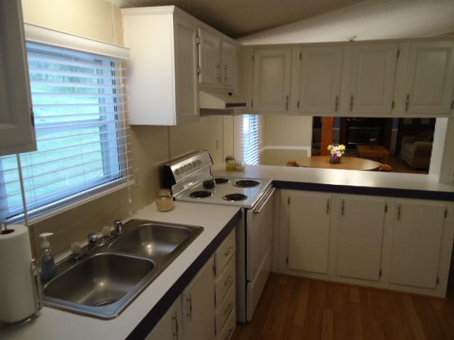 165 Minnie Brown Road Ardmore, TN 38449 - Photo 7 of 20 Kitchen-New laminate flooring throughout the home.