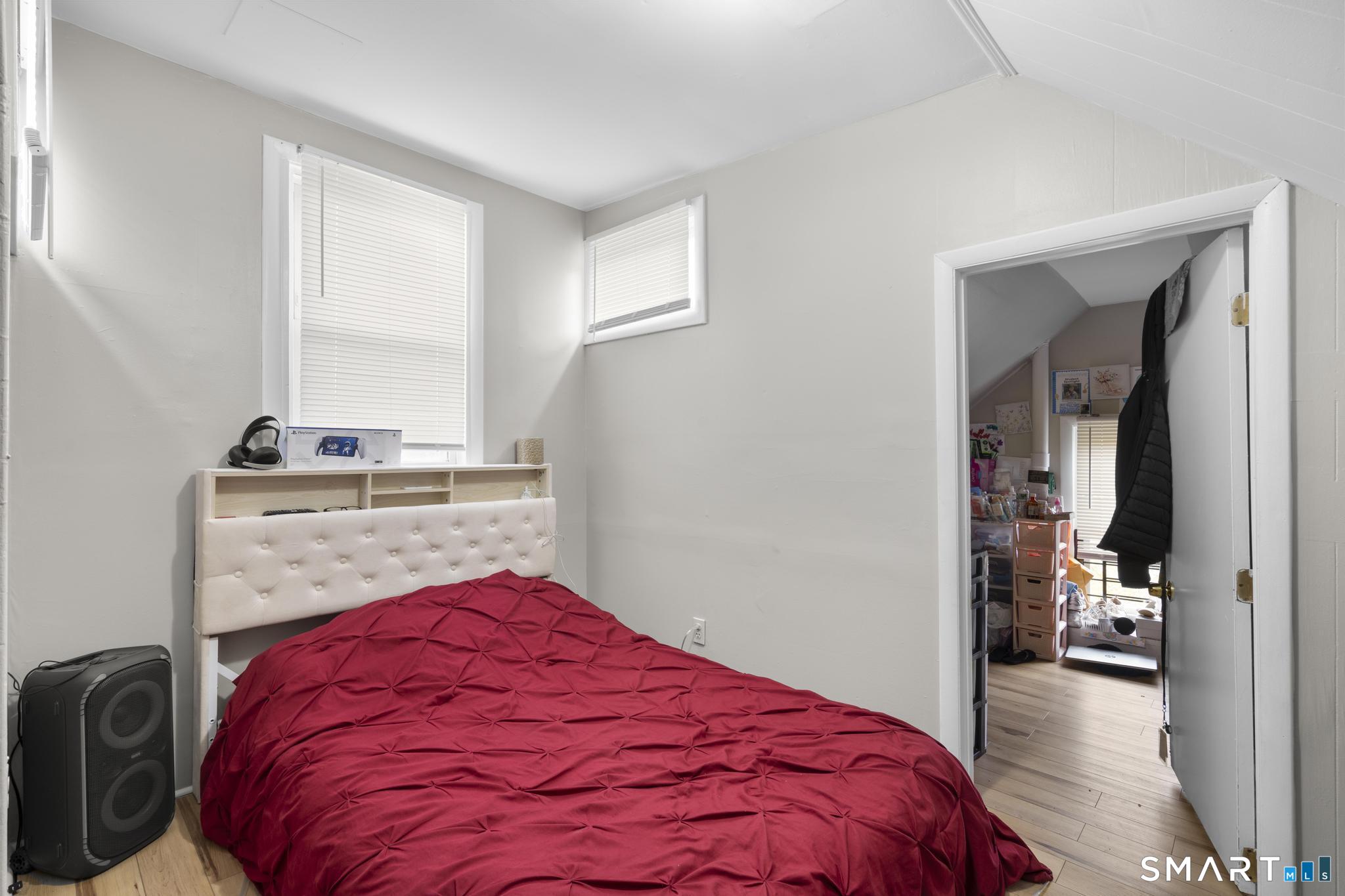 45 Cliff Street Norwich, CT 06360 - Photo 12 of 39 a bedroom with a bed and dresser