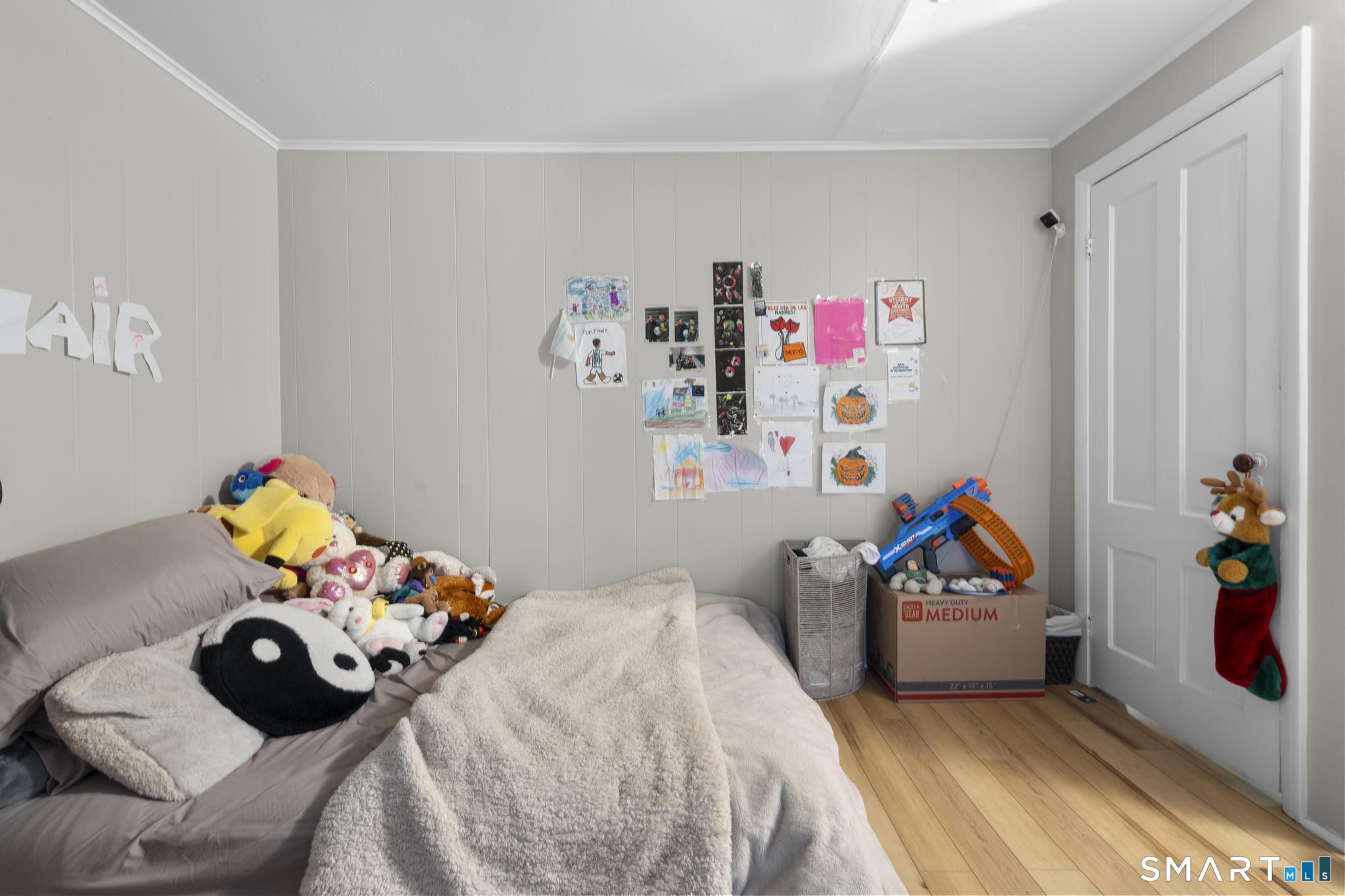 45 Cliff Street Norwich, CT 06360 - Photo 14 of 39 a bedroom with a bed and a couch