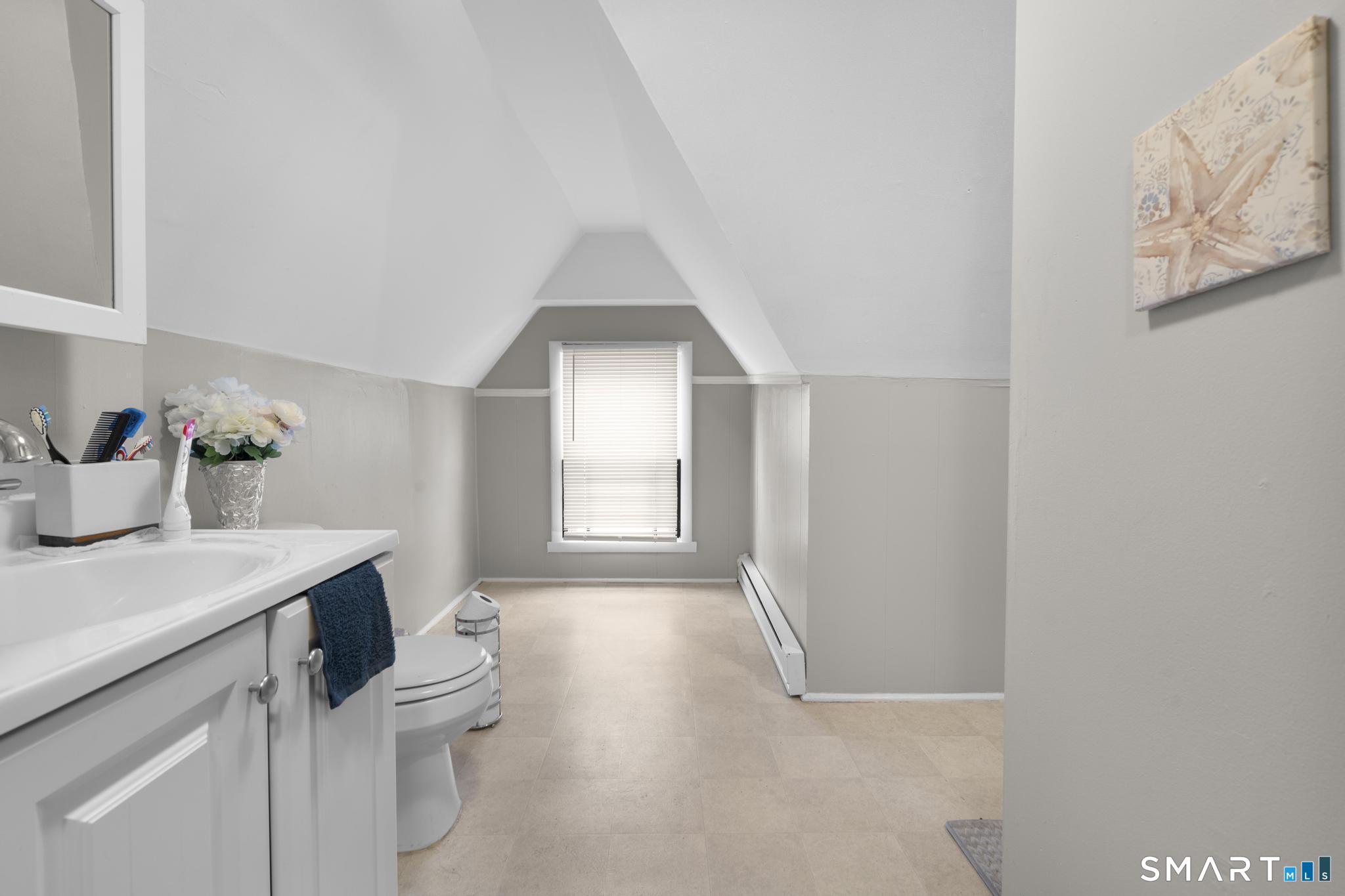 45 Cliff Street Norwich, CT 06360 - Photo 15 of 39 a view of a kitchen with a sink and dishwasher with wooden floor