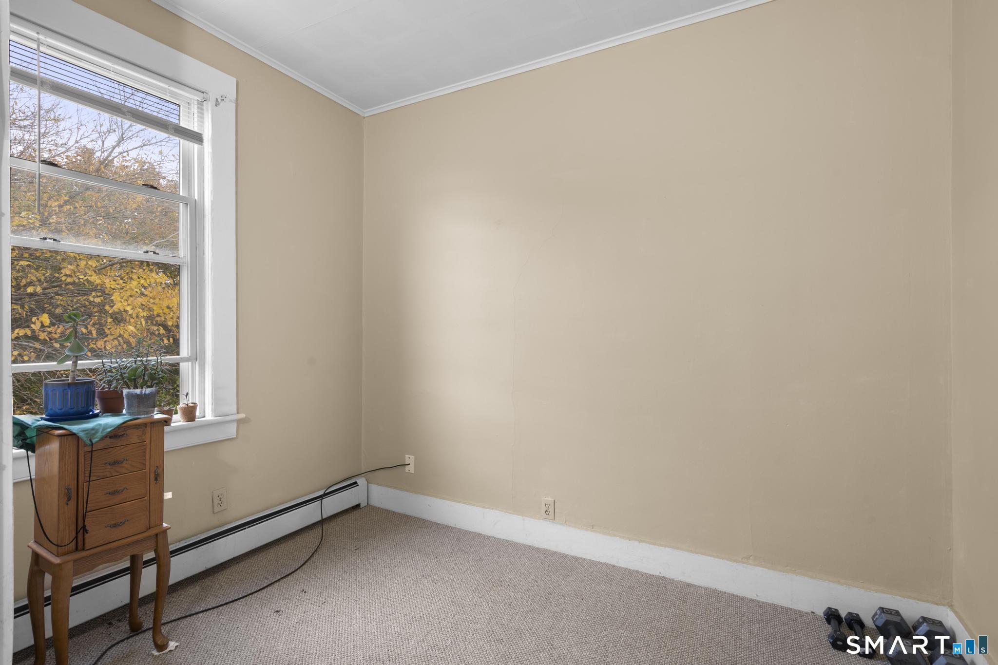 45 Cliff Street Norwich, CT 06360 - Photo 20 of 39 an empty room with windows