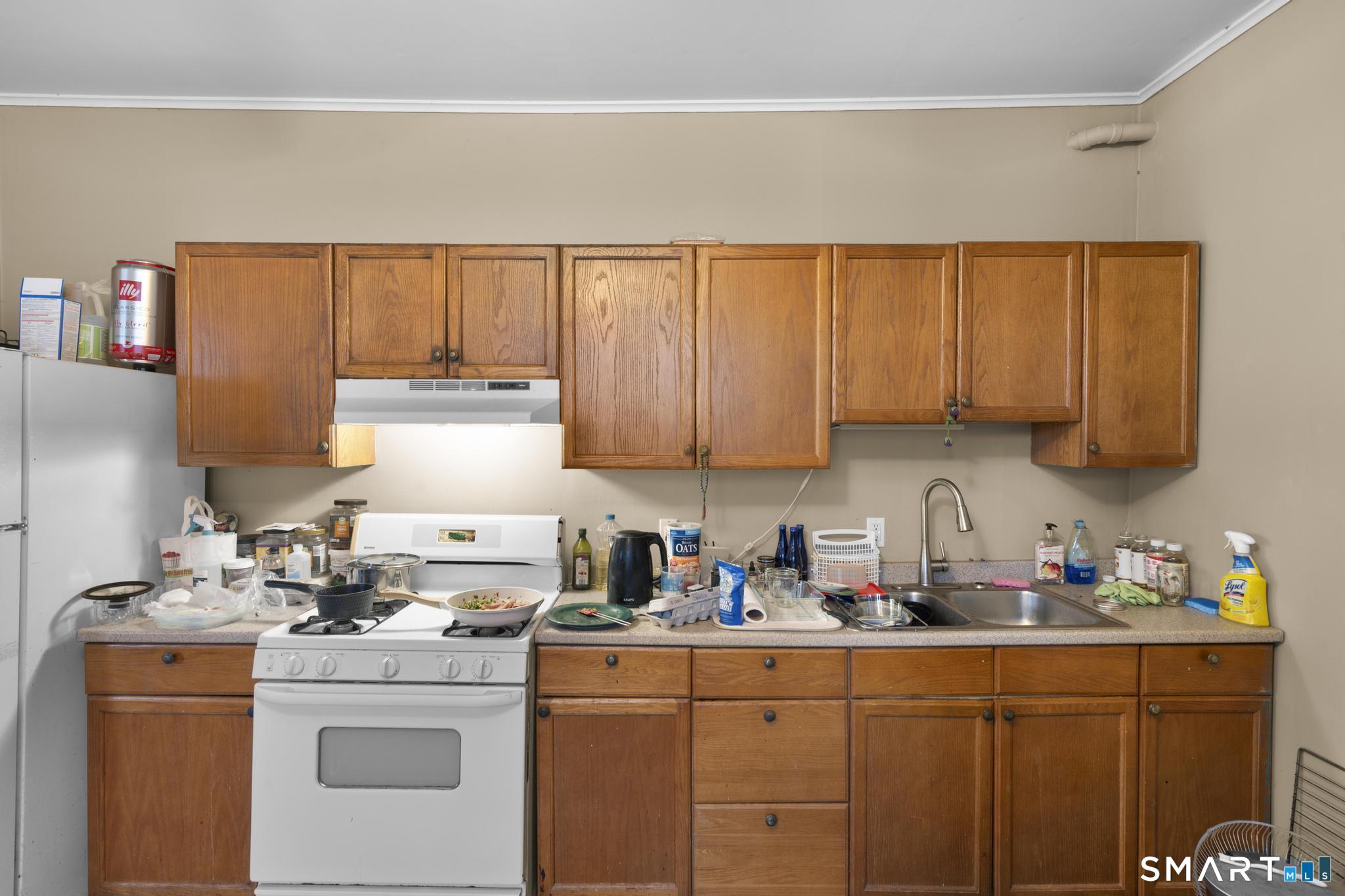 45 Cliff Street Norwich, CT 06360 - Photo 25 of 39 a kitchen with a sink cabinets and window