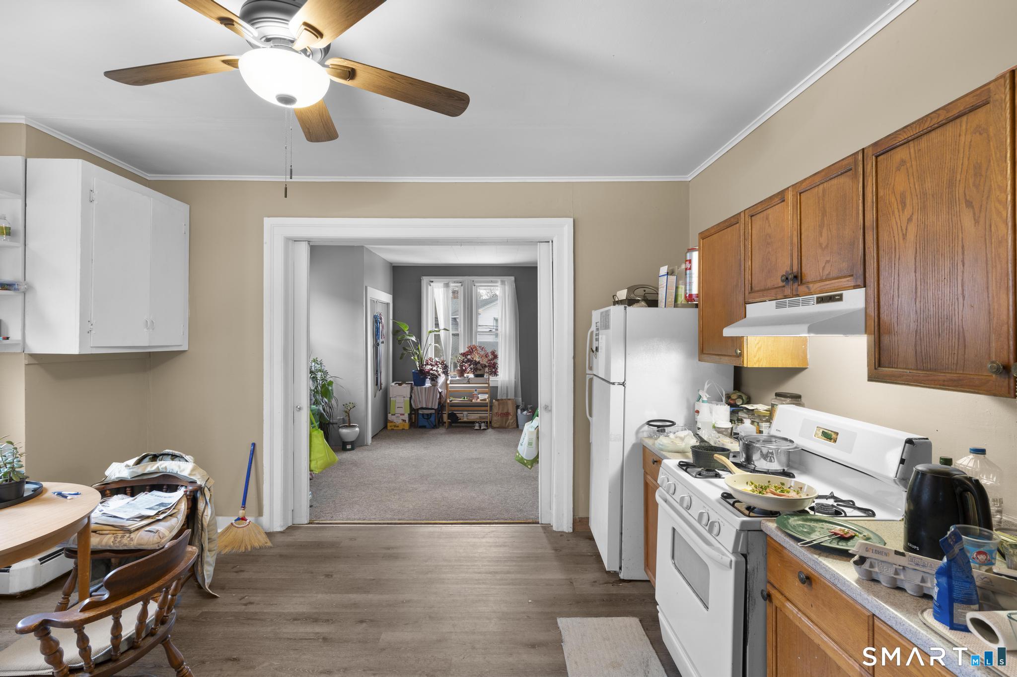 45 Cliff Street Norwich, CT 06360 - Photo 26 of 39 a kitchen with a table and chairs