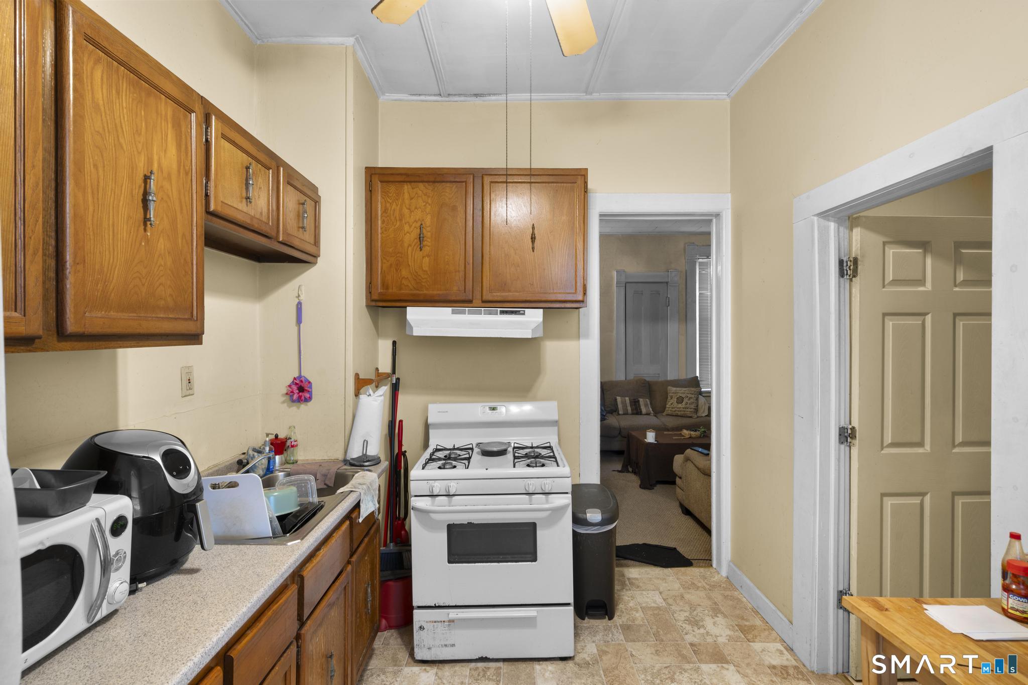 45 Cliff Street Norwich, CT 06360 - Photo 28 of 39 a kitchen with a stove and a sink