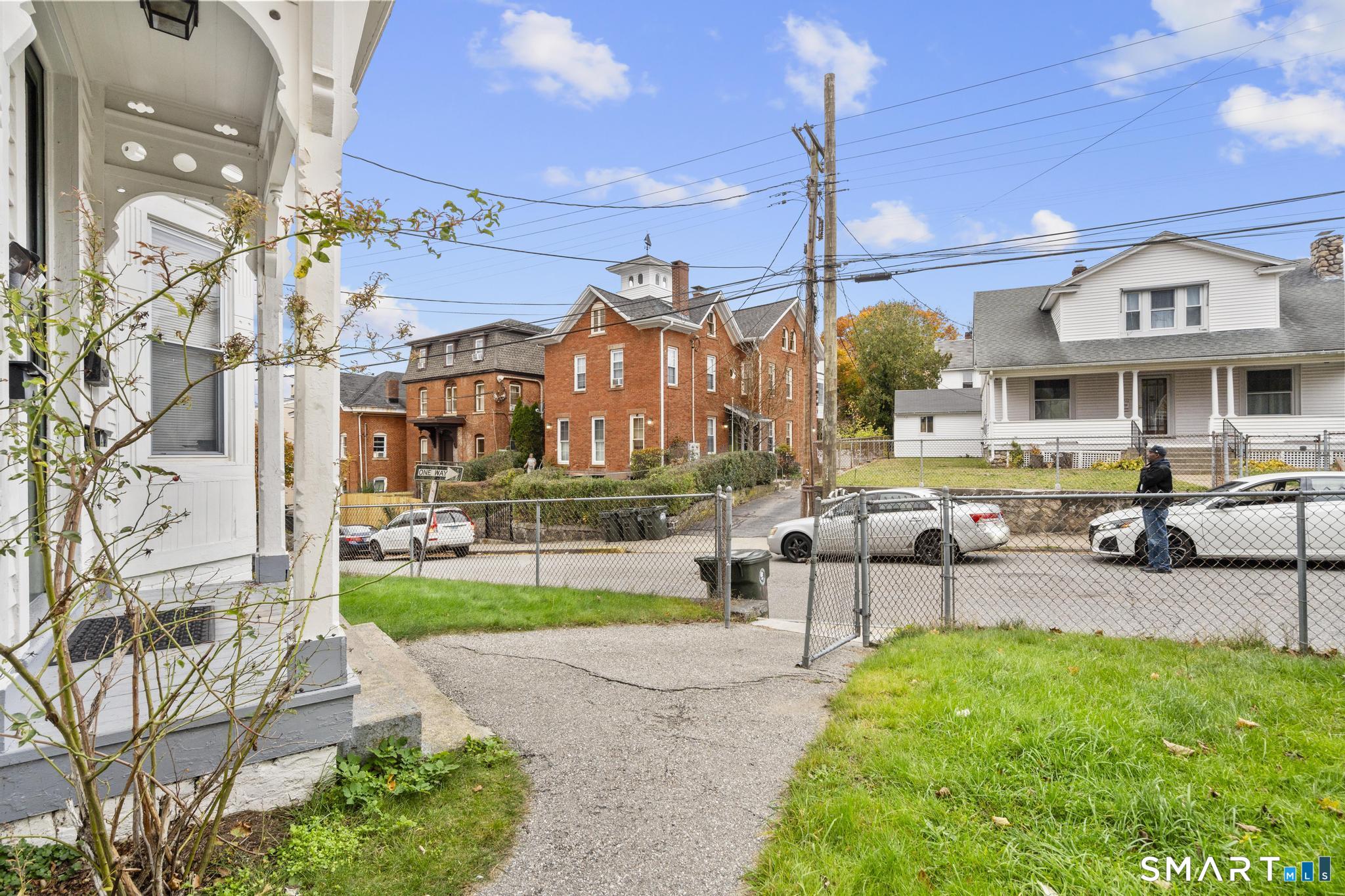 45 Cliff Street Norwich, CT 06360 - Photo 3 of 39 a view of a chairs and tables in the patio