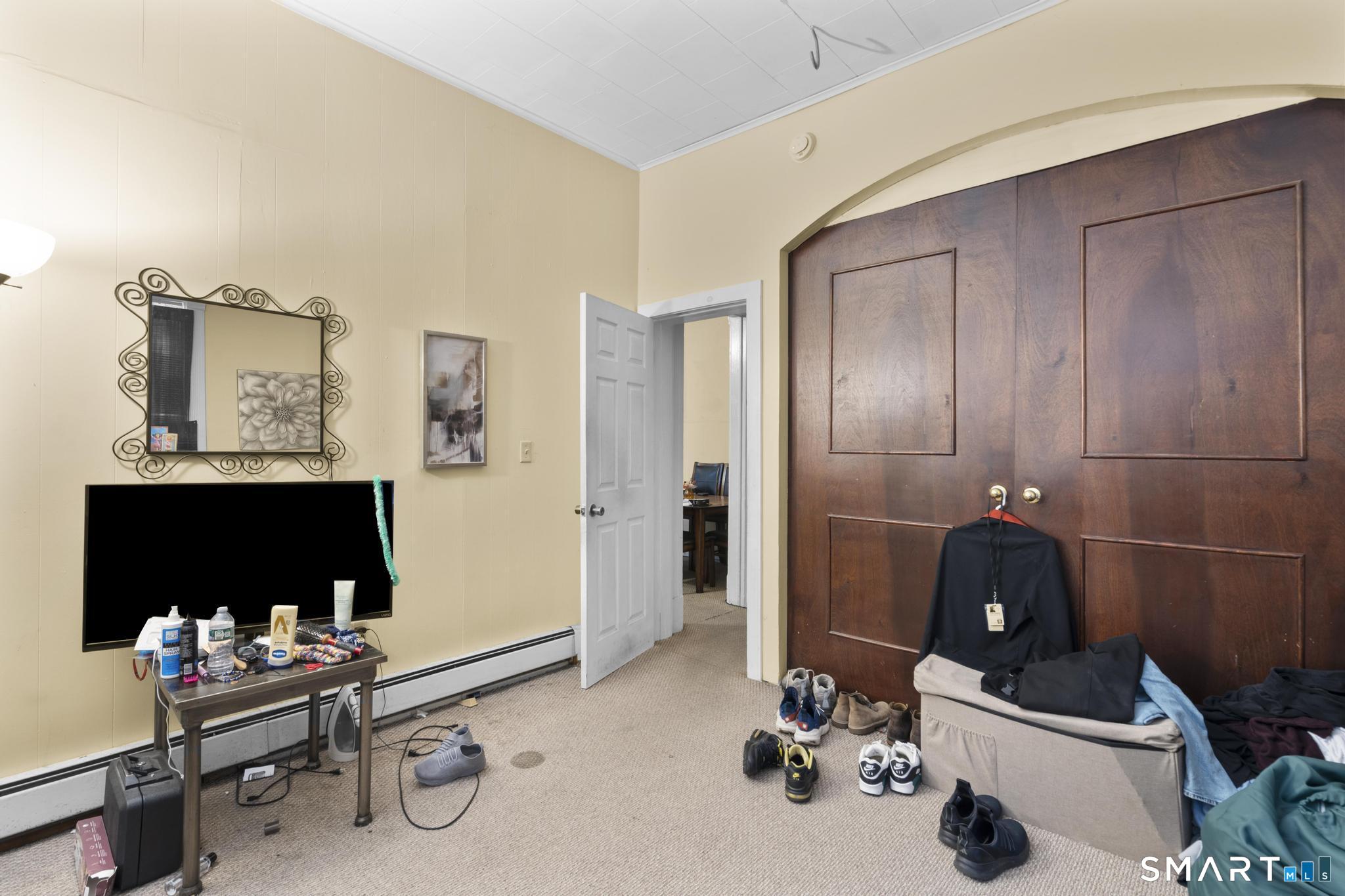 45 Cliff Street Norwich, CT 06360 - Photo 35 of 39 a room with a table and cabinets