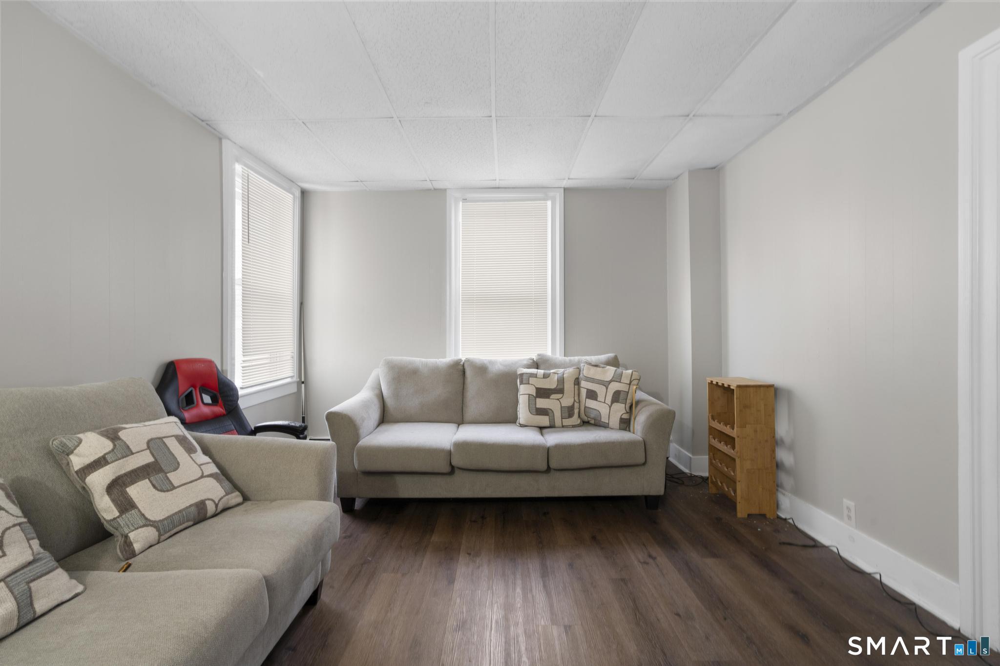 45 Cliff Street Norwich, CT 06360 - Photo 8 of 39 a living room with furniture and a window