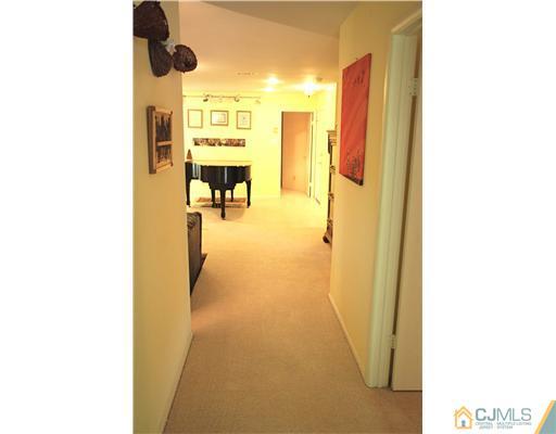 74 Woodbury Road Edison, NJ 08820 - Photo 13 of 23 a view of a hallway with painted walls
