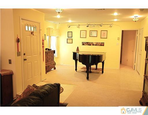 74 Woodbury Road Edison, NJ 08820 - Photo 14 of 23 a view of a swimming pool and furniture