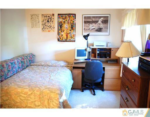 74 Woodbury Road Edison, NJ 08820 - Photo 17 of 23 a bedroom with a workspace