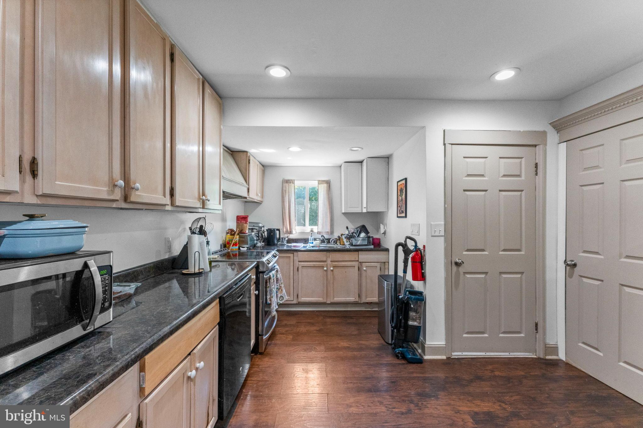 107 Hawthorne Avenue Ewing, NJ 08638 - Photo 11 of 18 a kitchen with refrigerator and cabinets