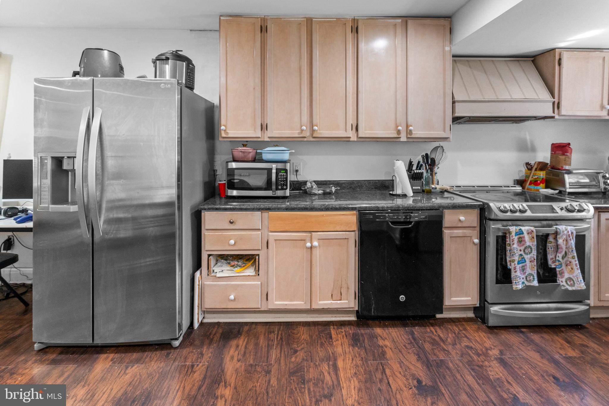 107 Hawthorne Avenue Ewing, NJ 08638 - Photo 12 of 18 a kitchen with a refrigerator sink and cabinets