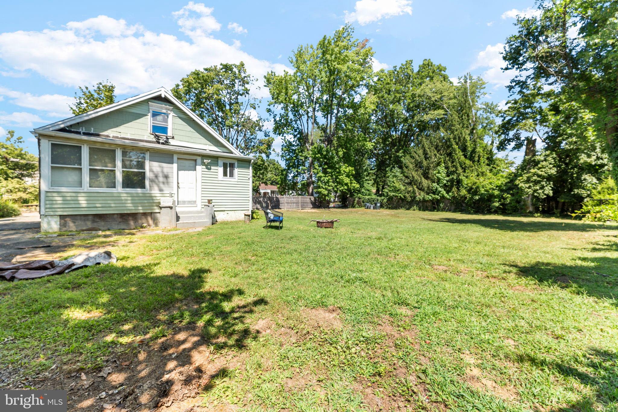 107 Hawthorne Avenue Ewing, NJ 08638 - Photo 16 of 18 a view of a house with a yard and sitting area