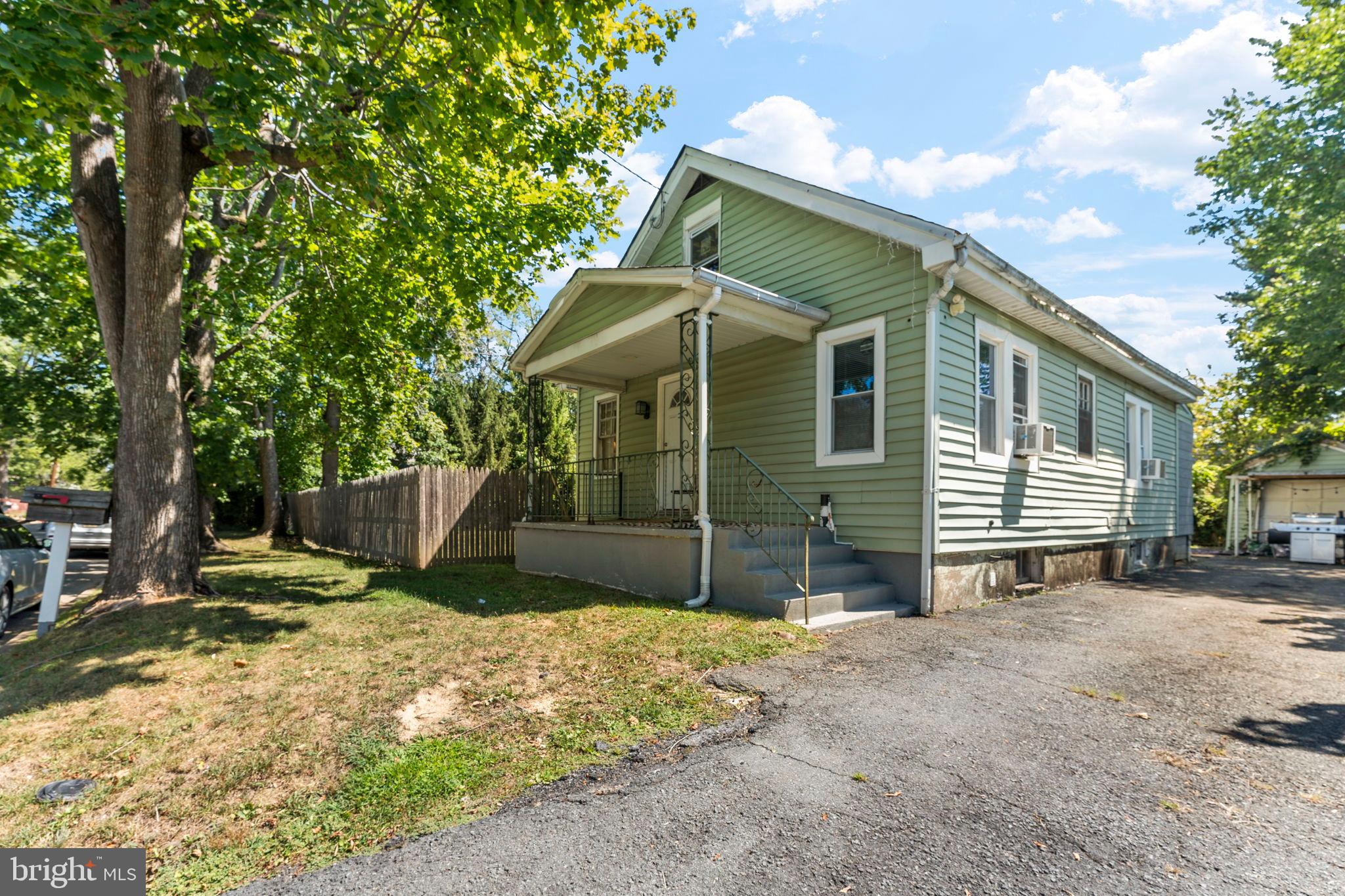 107 Hawthorne Avenue Ewing, NJ 08638 - Photo 2 of 18 a view of a house with a yard and large tree