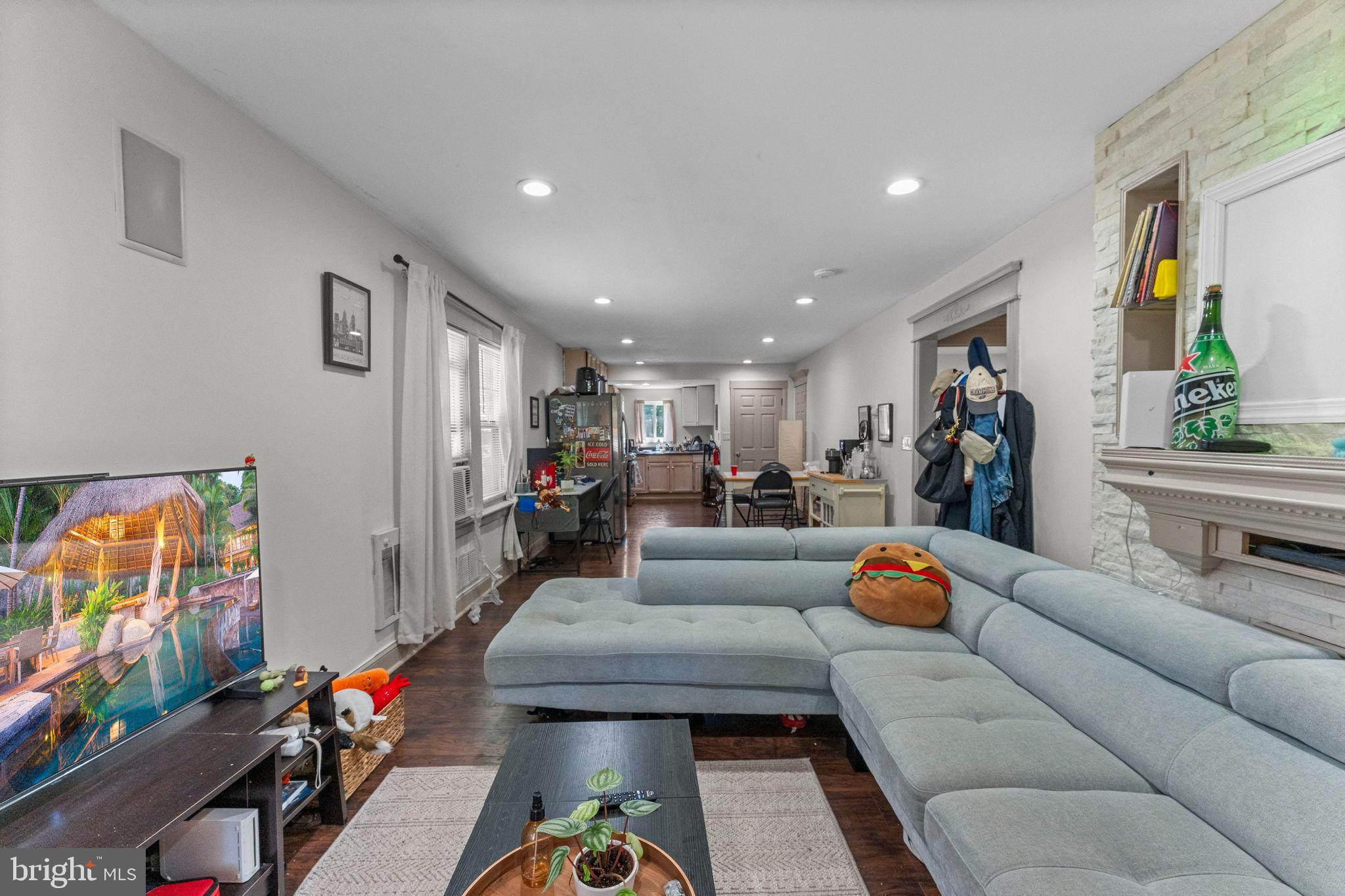 107 Hawthorne Avenue Ewing, NJ 08638 - Photo 4 of 18 a living room with furniture and a flat screen tv