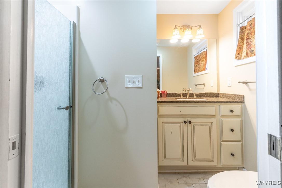 245 Ranch Trail Amherst, NY 14221 - Photo 20 of 37 Primary bathroom with walk in shower.
