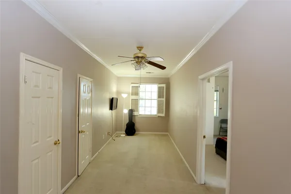 a view of a hallway with a chandelier