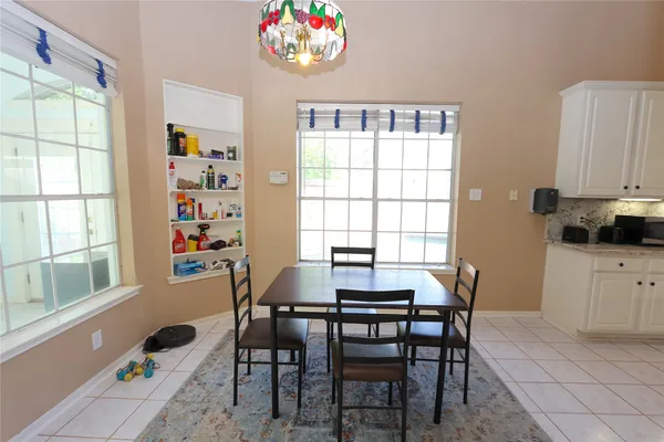a view of a dining room with furniture window and outside view