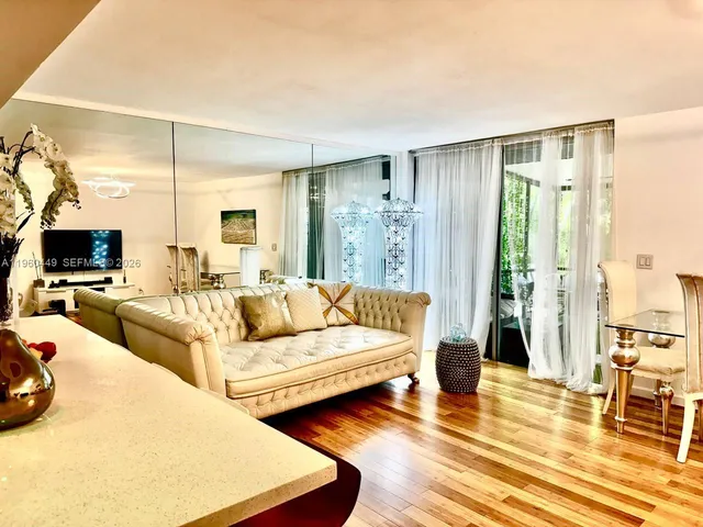 a view of a living room and kitchen
