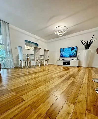 a living room with granite countertop kitchen furniture and a table