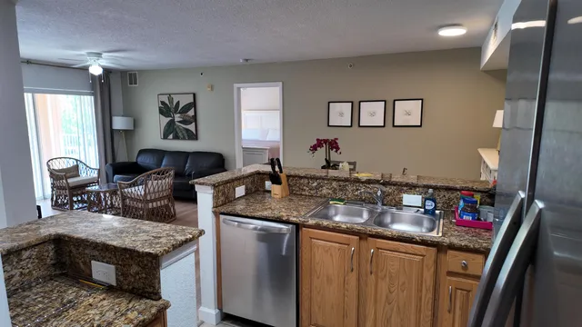 a living room with granite countertop furniture and a fireplace