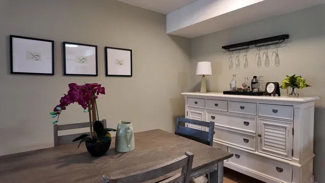 a kitchen with a wooden floor and breakfast area