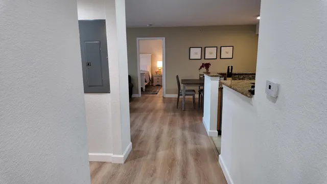 a view of a kitchen from the hallway