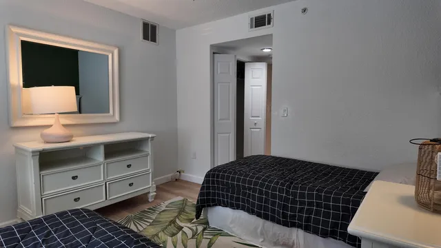 a bedroom with a bed and a dresser