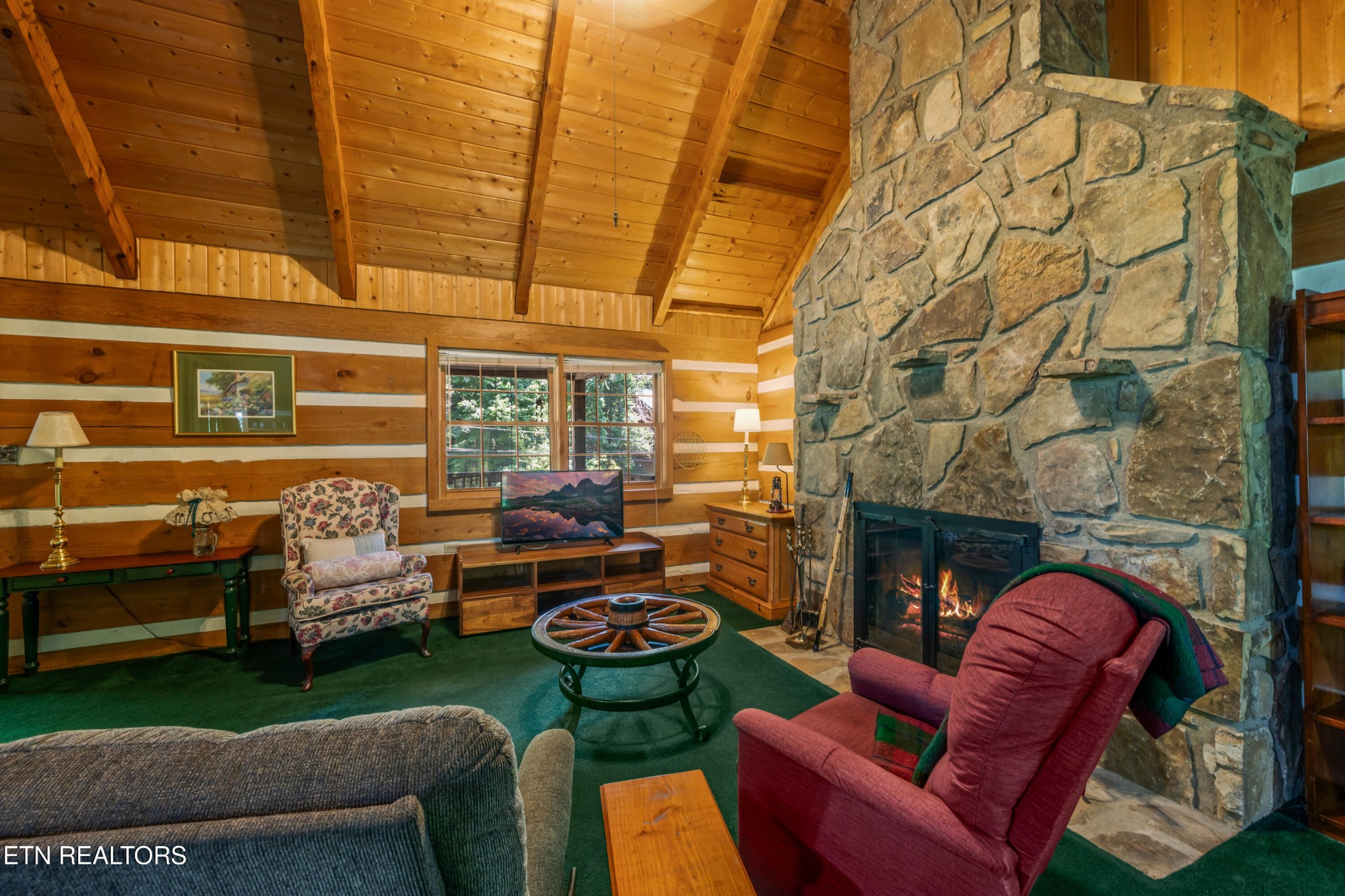 727 Hidden Valley Road Gatlinburg, TN 37738 - Photo 8 of 22 a backyard of a house with fireplace table and chairs