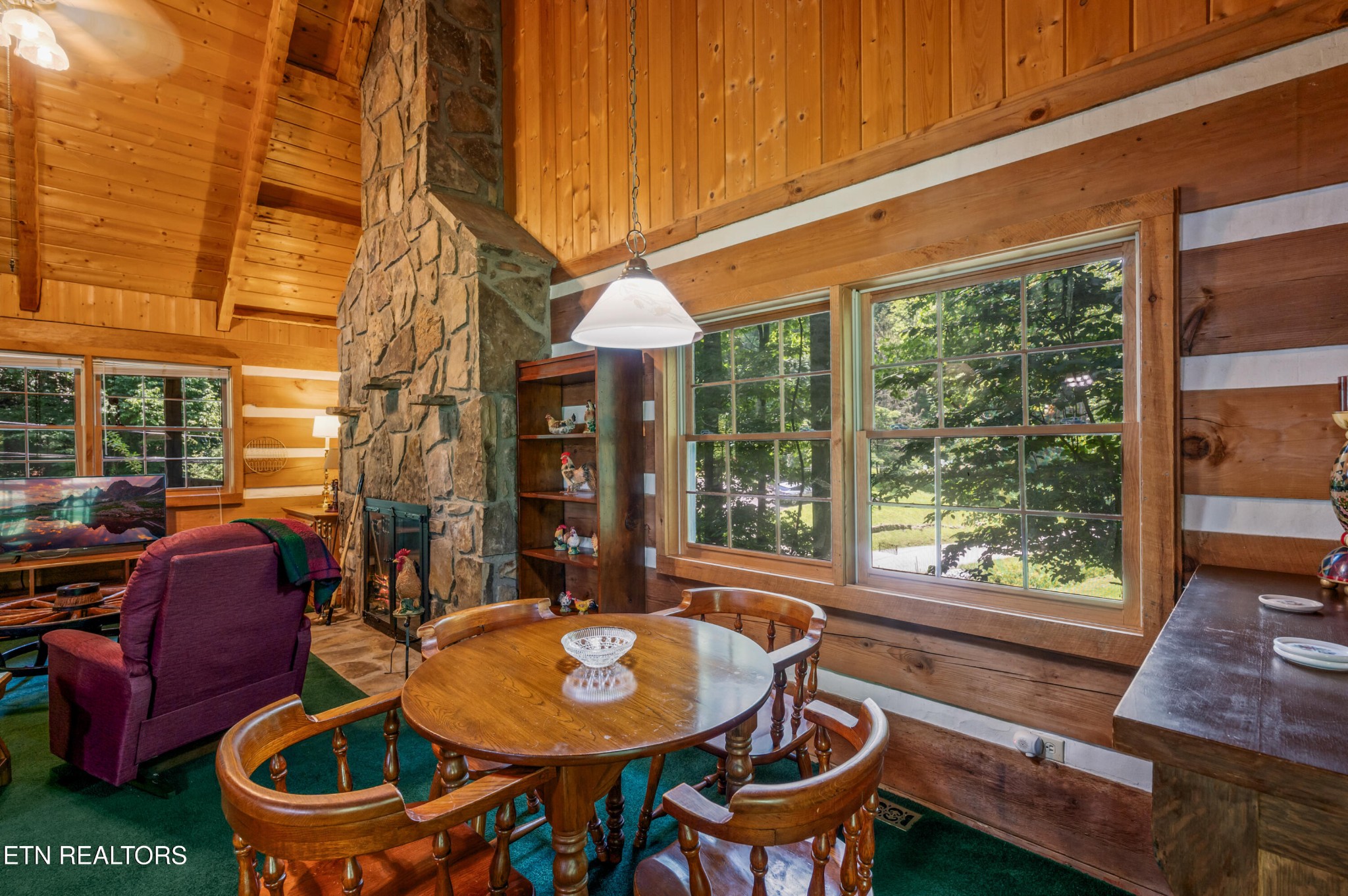 727 Hidden Valley Road Gatlinburg, TN 37738 - Photo 9 of 22 a dining room with furniture a rug and wooden floor