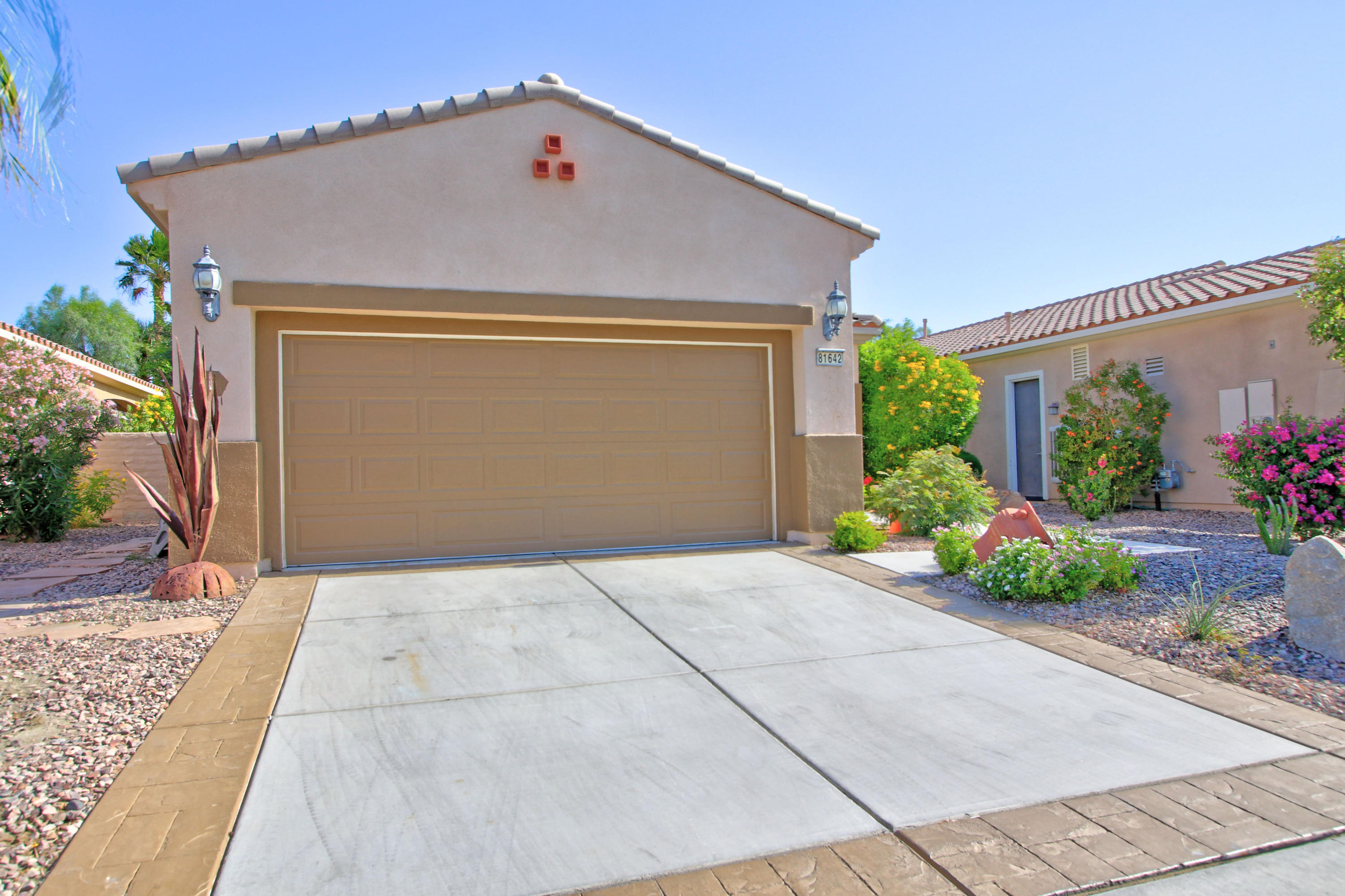 81642 Avenida Bolero Indio, CA 92203 - Photo 1 of 38 a front view of house along with garage