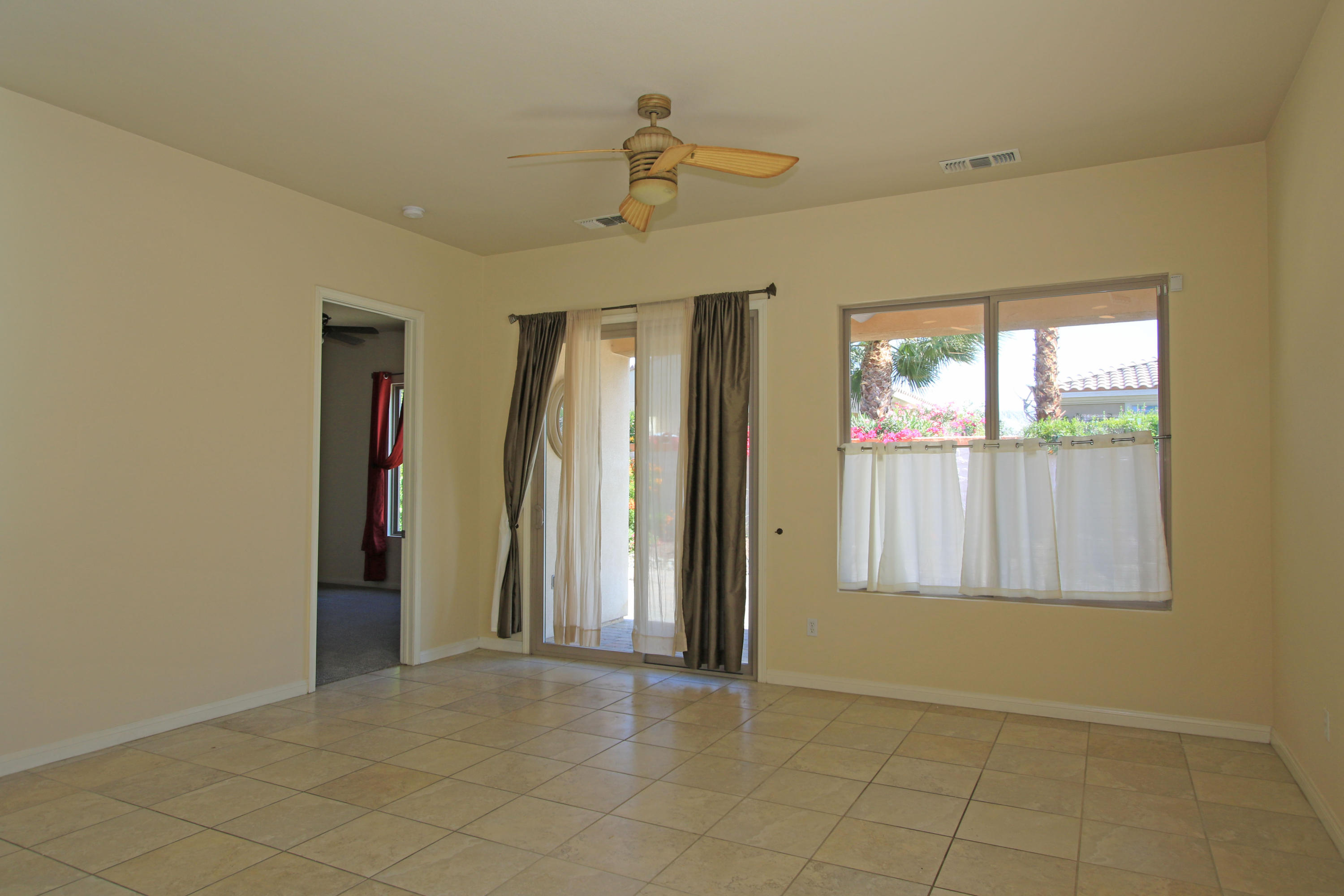 81642 Avenida Bolero Indio, CA 92203 - Photo 17 of 38 an empty room with windows and closet