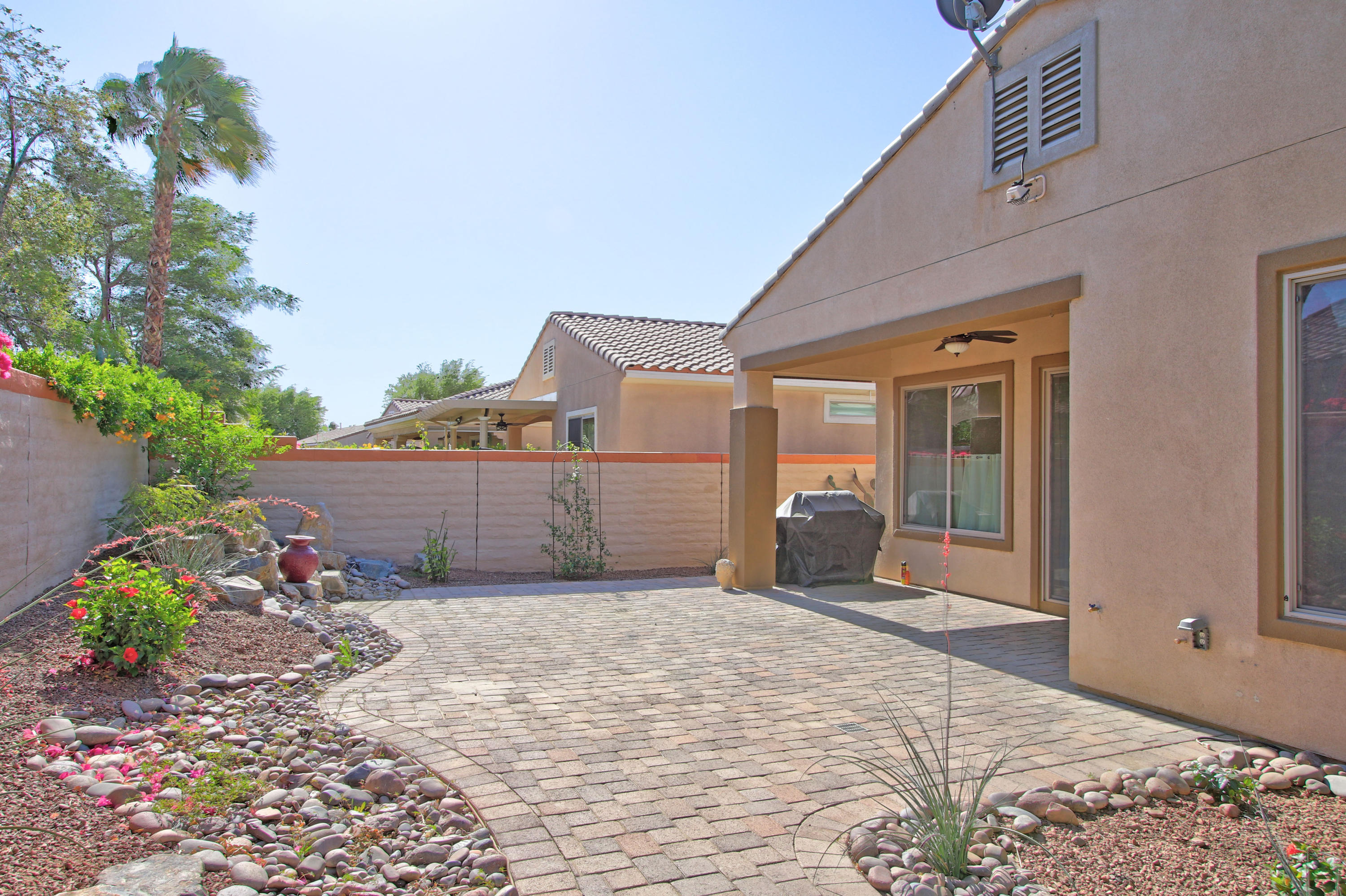 81642 Avenida Bolero Indio, CA 92203 - Photo 20 of 38 a view of a house with a yard and potted plants