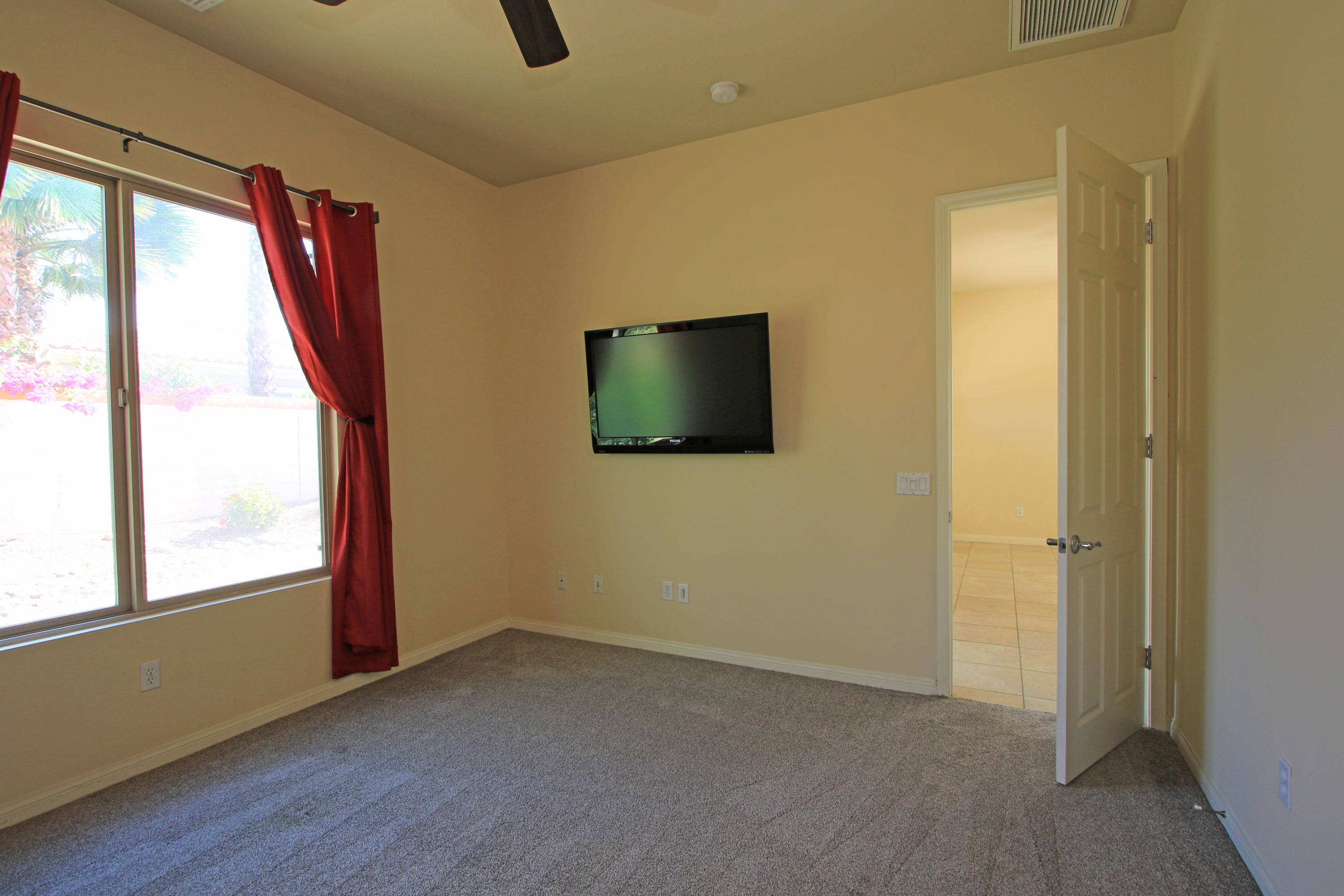81642 Avenida Bolero Indio, CA 92203 - Photo 24 of 38 a view of a livingroom with wooden floor and windows