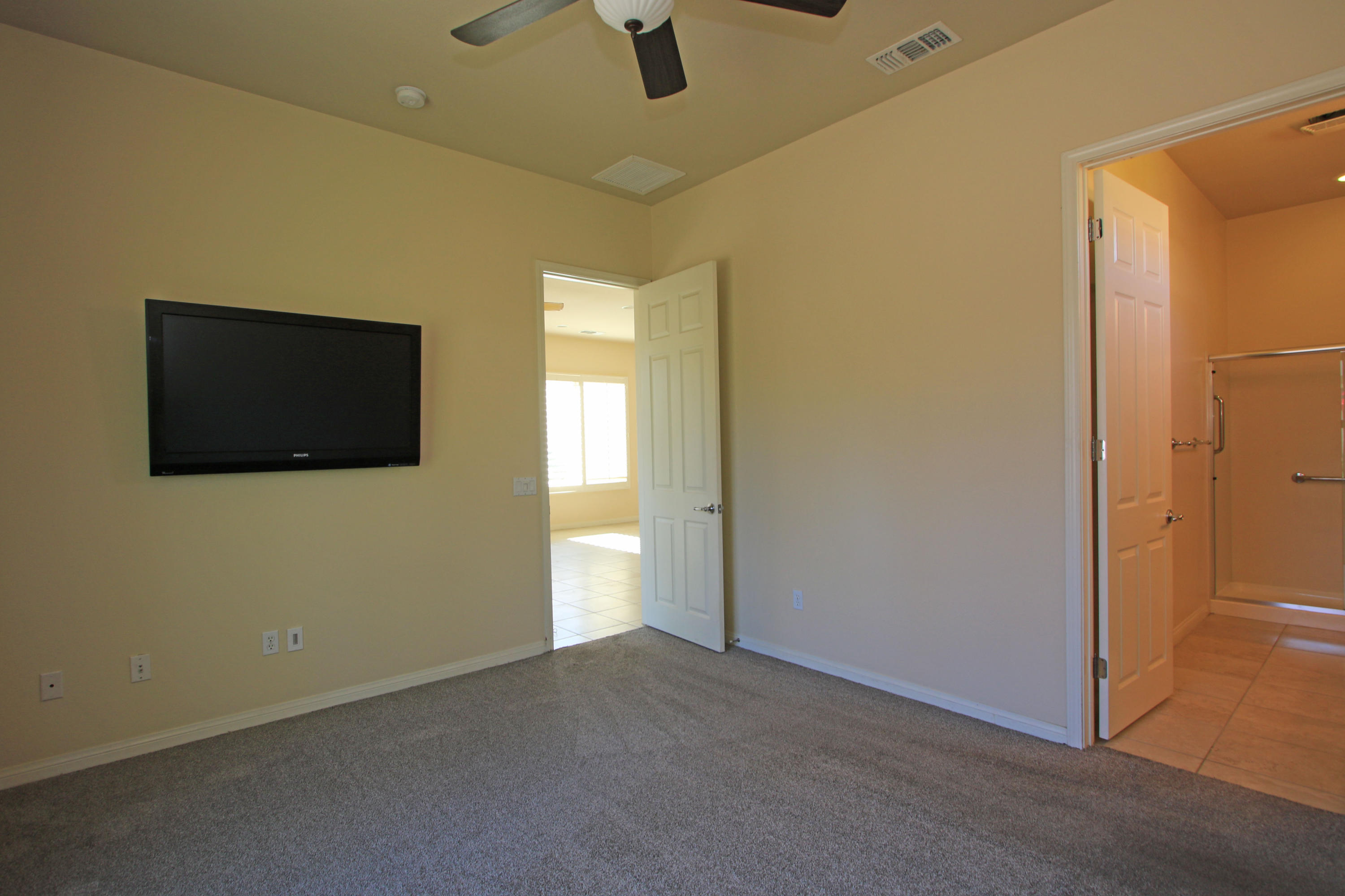 81642 Avenida Bolero Indio, CA 92203 - Photo 25 of 38 a view of a livingroom with wooden floor and flat screen tv