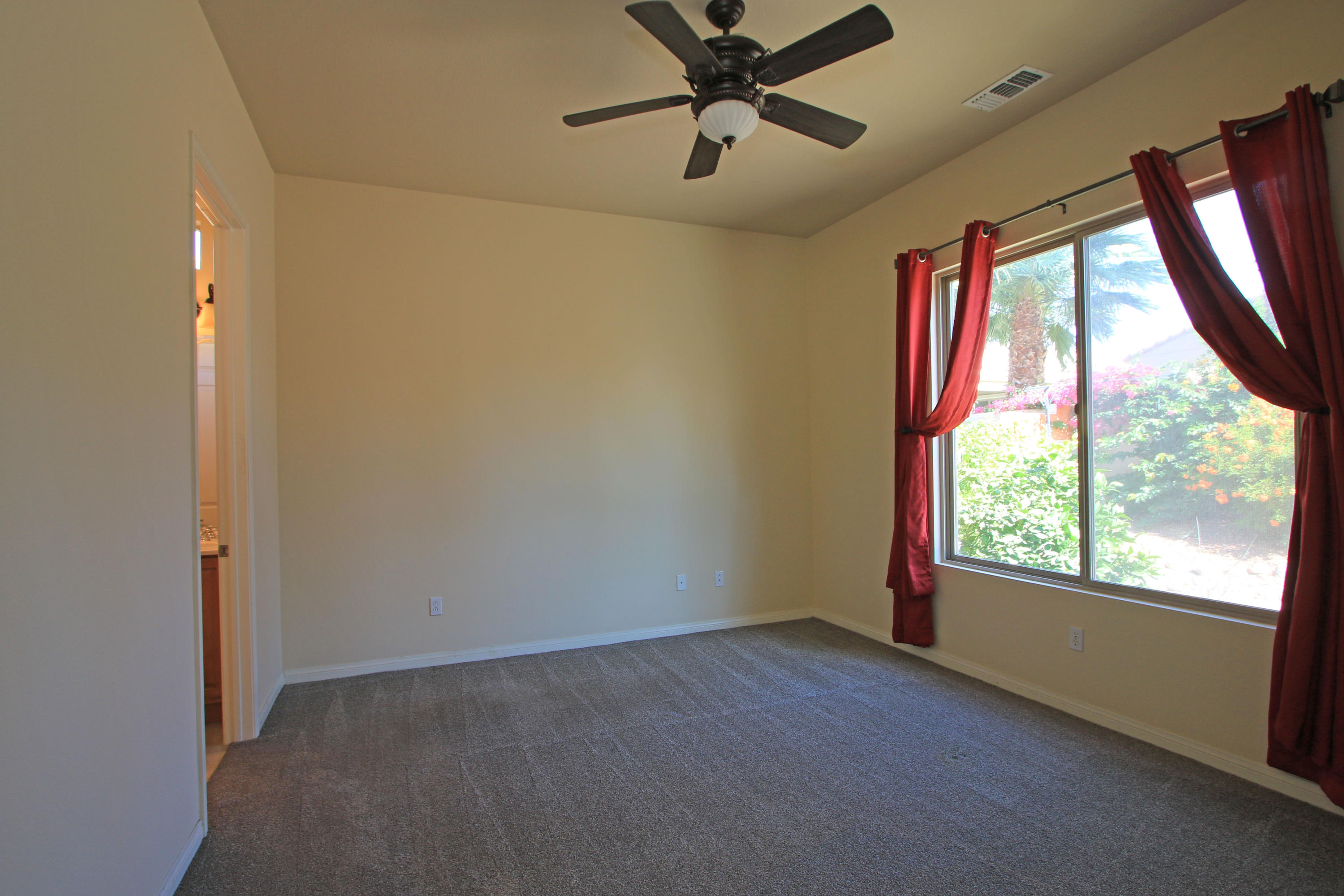 81642 Avenida Bolero Indio, CA 92203 - Photo 26 of 38 a view of empty room with window and a ceiling fan
