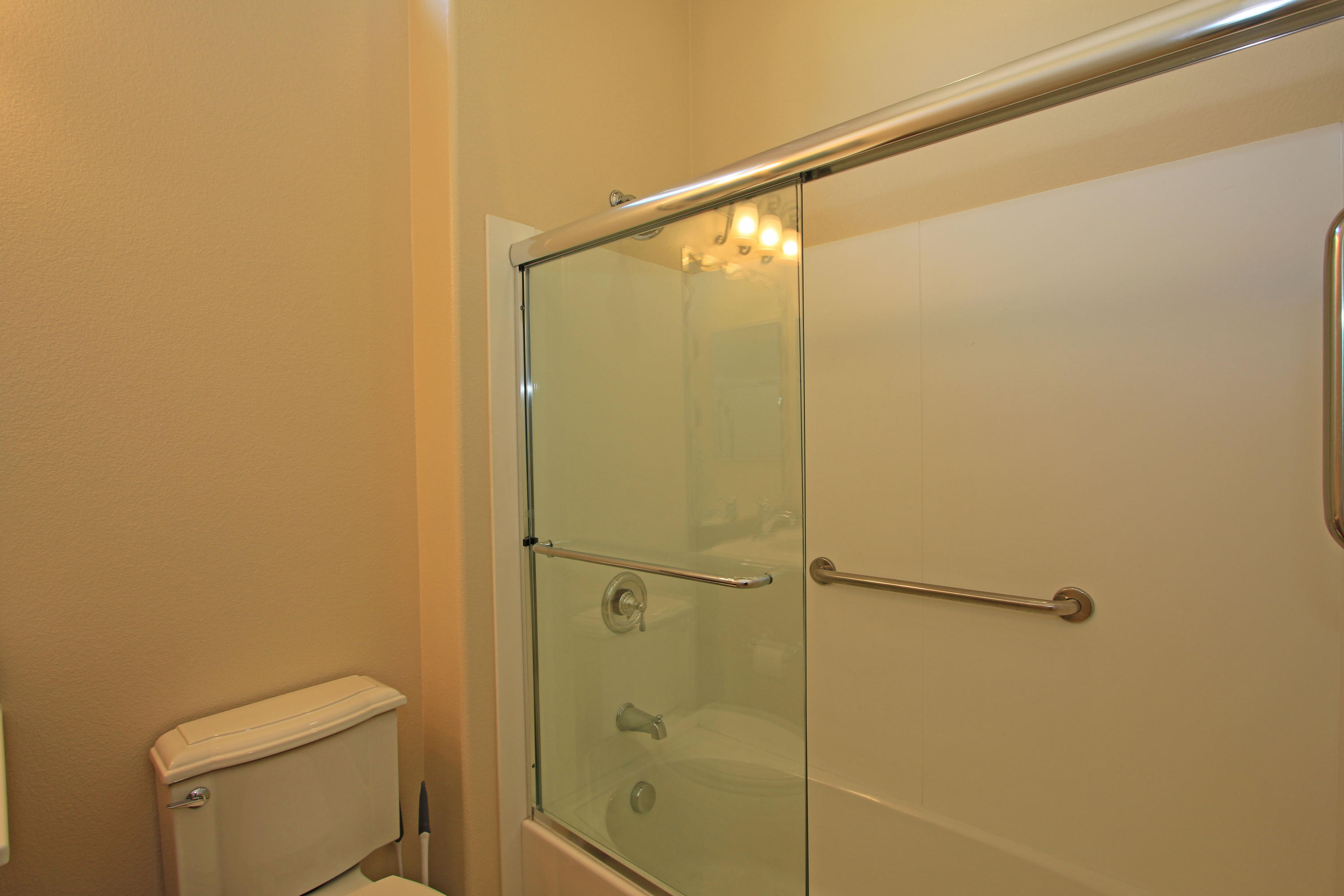 81642 Avenida Bolero Indio, CA 92203 - Photo 29 of 38 a bathroom with a shower and a toilet