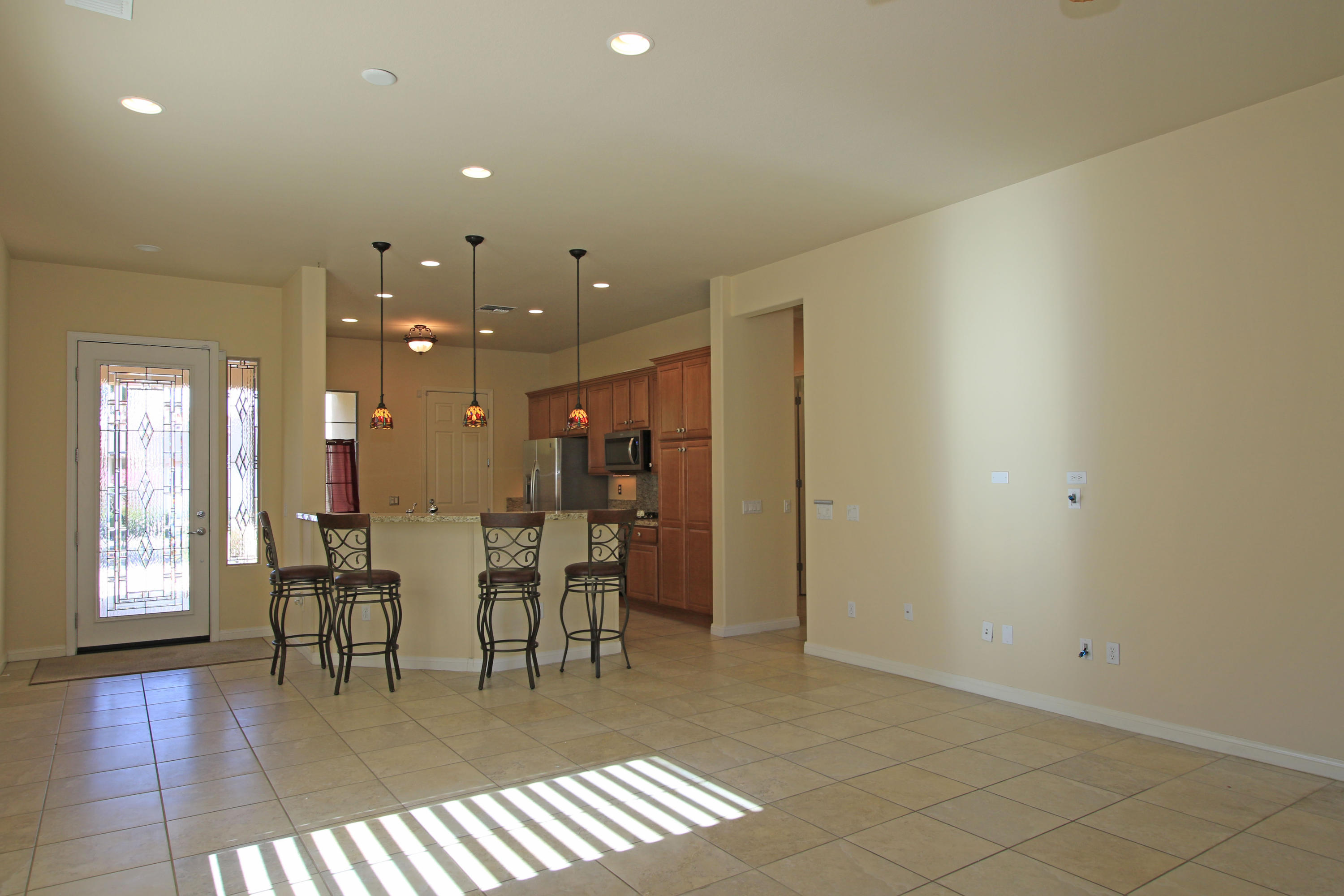 81642 Avenida Bolero Indio, CA 92203 - Photo 7 of 38 a dining room with furniture and wooden floor