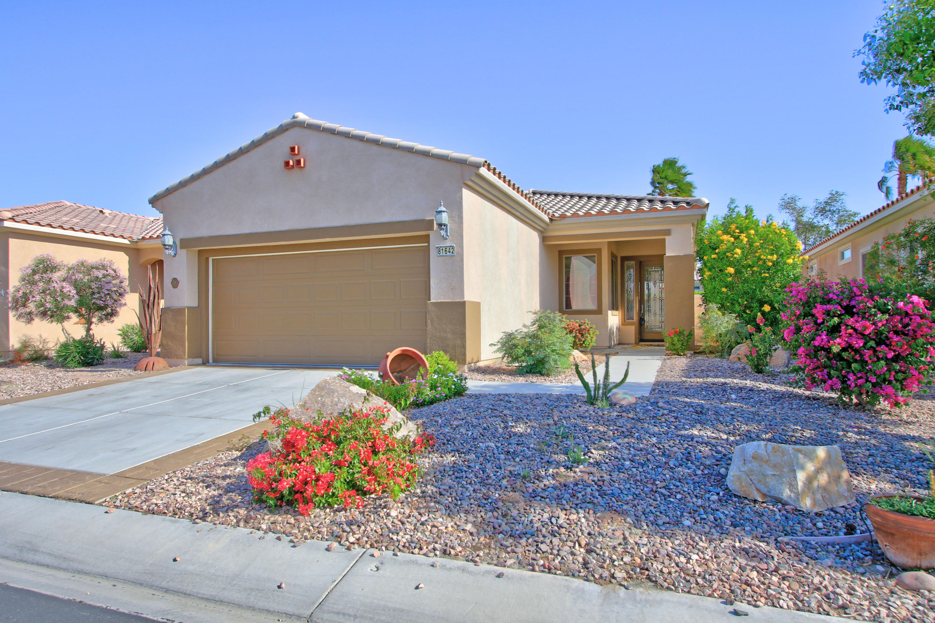 81642 Avenida Bolero Indio, CA 92203 - Photo 9 of 38 a front view of a house with garden