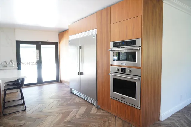 a view of kitchen with a sink oven and a window