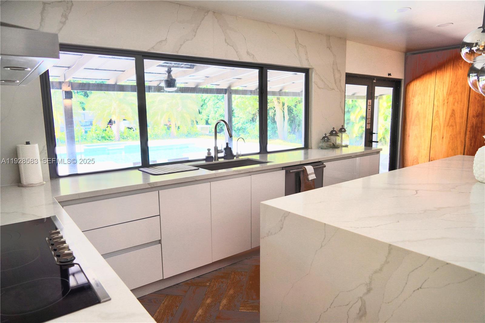 18901 Southwest 50th Street Southwest Ranches, FL 33332 - Photo 13 of 51 a large white kitchen with a large window